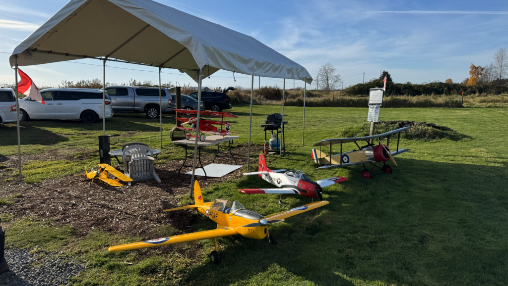 Model airplanes sit next to the tent at Renegade Flyers field.
